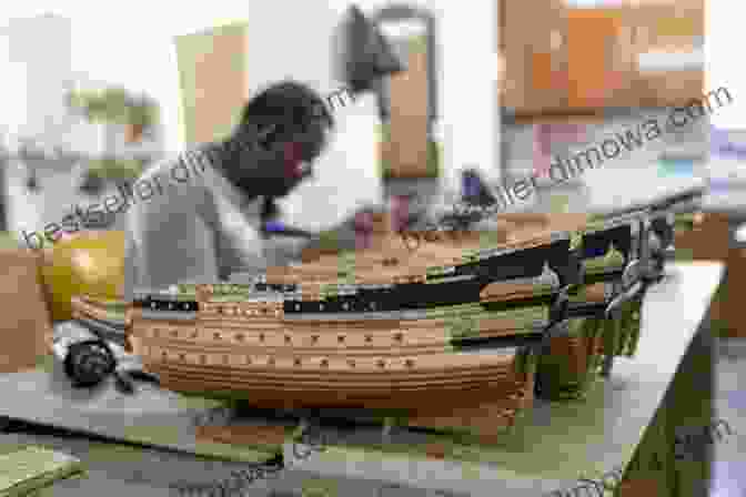 A Craftsman Working On A Wooden Ship Model, Showcasing The Mastery And Skill Of Dutch Artisans The Bookshop Of The World: Making And Trading In The Dutch Golden Age