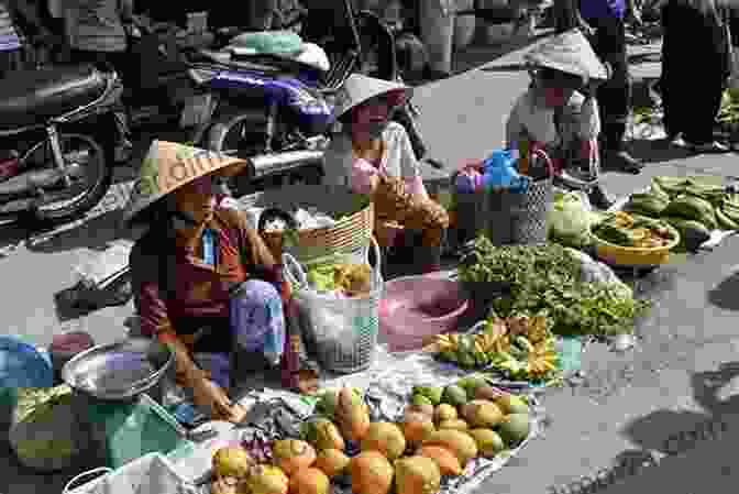 A Vibrant Street Vendor In Hanoi, Vietnam, Offering A Variety Of Fresh Fruits And Vegetables. Vegetarian Vietnam Travel Report Teresa Bergen